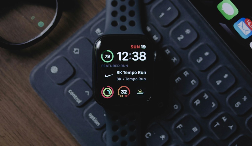 A smartwatch showing activity data on a wrist.